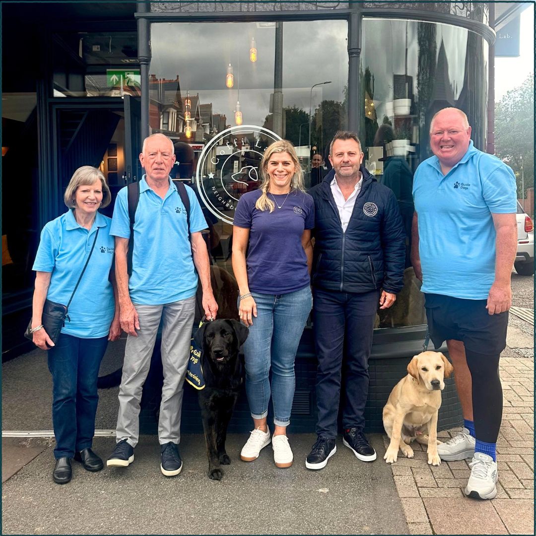 Coffi Lab founder and Managing Director outside the Whitchurch Lab with Guide Dog puppies and their puppy raisers